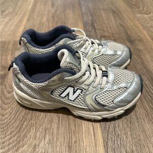 New Balance Silver and Black Sneakers with Supportive Midsole